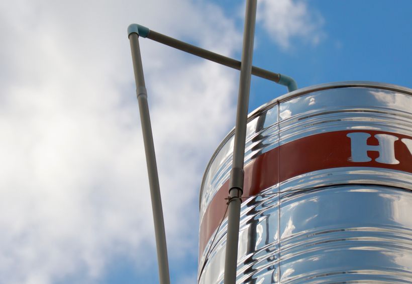 Steel water storage tank and supply piping on a Kerr County property